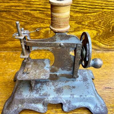 Lot 19: Vintage mini sewing machine, leather rivet cutter and more