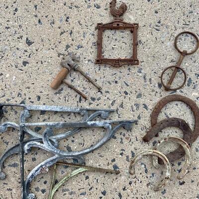 Lot 83: Cast iron planter, horse shoes and more 