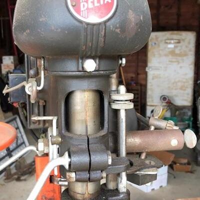 Lot 89 G: Vintage Delta drill press with two boxes of bits