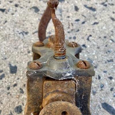 Lot 90: Vintage cast iron tree stand and antique sprinkler
