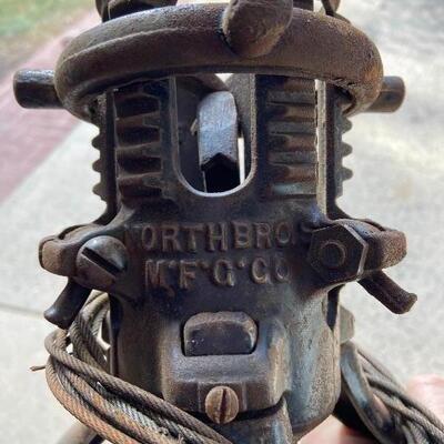 Lot 90: Vintage cast iron tree stand and antique sprinkler