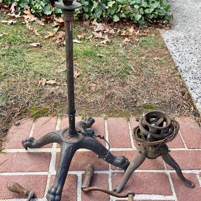 Lot 90: Vintage cast iron tree stand and antique sprinkler