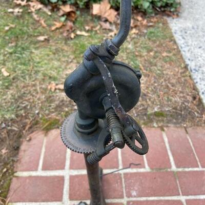Lot 90: Vintage cast iron tree stand and antique sprinkler