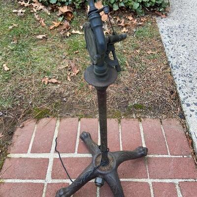 Lot 90: Vintage cast iron tree stand and antique sprinkler