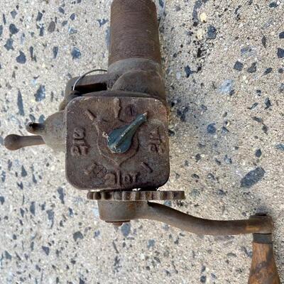 Lot 90: Vintage cast iron tree stand and antique sprinkler