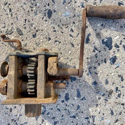 Lot 90: Vintage cast iron tree stand and antique sprinkler