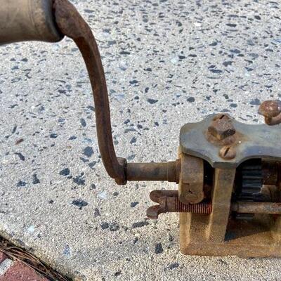 Lot 90: Vintage cast iron tree stand and antique sprinkler