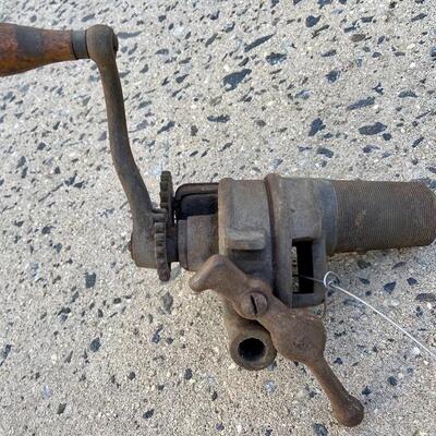 Lot 90: Vintage cast iron tree stand and antique sprinkler