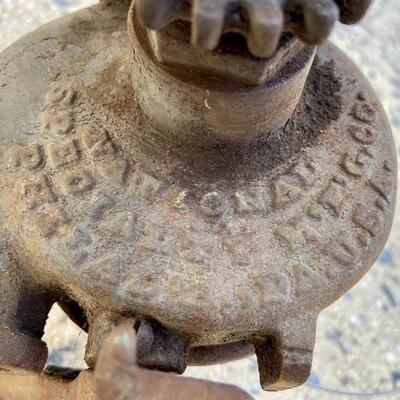 Lot 90: Vintage cast iron tree stand and antique sprinkler