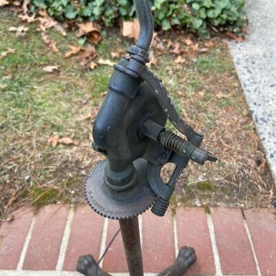 Lot 90: Vintage cast iron tree stand and antique sprinkler