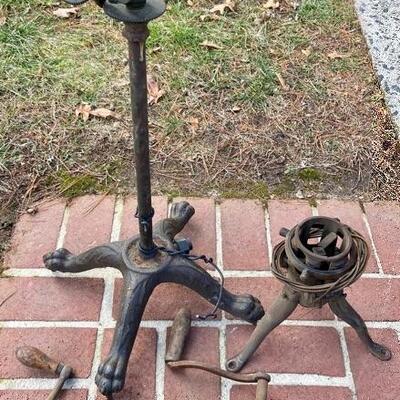 Lot 90: Vintage cast iron tree stand and antique sprinkler