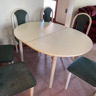  Lot 1. Formica dining table, white top, with 6 upholstered chairs; oval-shaped, 50â€x42â€,with one leaf--$20