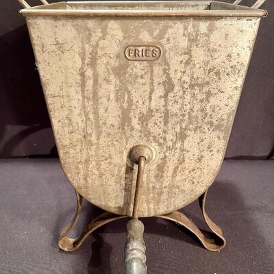 Lot 161: Cast Iron Paper Holder- Fries Sifter-Juicer and more. 