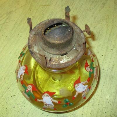 Lot 197 - Oil Lamp with a Circle of Gnomes