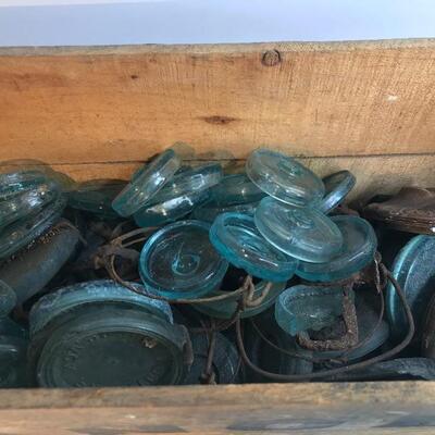Lot 201:  Large lot Antique Glass Jar Lids/ Advertising Crate