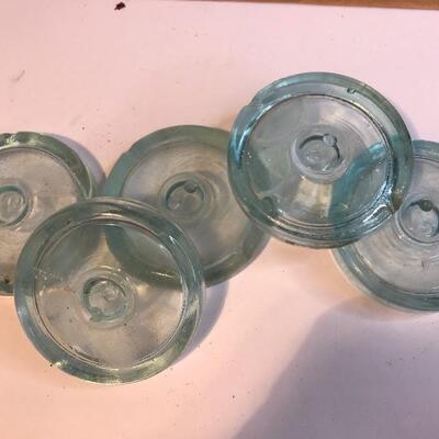 Lot 201:  Large lot Antique Glass Jar Lids/ Advertising Crate