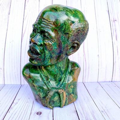 LOT 51  BUST OF TRIBAL MAN CARVED GREEN HARDSTONE WITH BROWN MARBLING