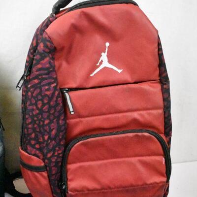 4 Bags: Gray Dell Backback, Red Jordan Backpack, Red lunch bag, Blue Ogio Duffle