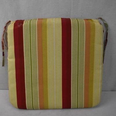 5 Outdoor Seat Cushions: Tan/Orange/Red/Green/Yellow Floral. Opposite is striped