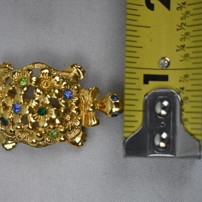 Turtle Lapel Pin by Avon. Gold tone with Blue & Green Stones
