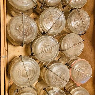 Lot 285: Box lot of 14 pint size Ball Ideal mason jars with wire bales and glass lids