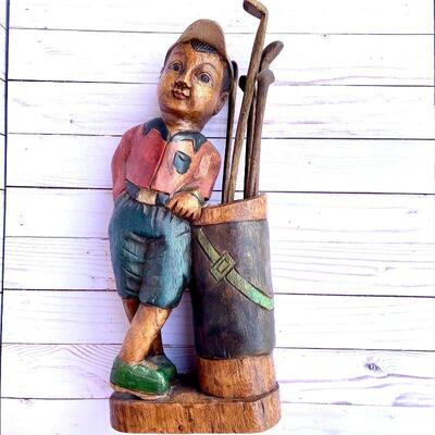 LOT 78  CARVED WOOD SCULPTURE LITTLE BOY CADDY GOLFER GOLF