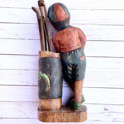 LOT 78  CARVED WOOD SCULPTURE LITTLE BOY CADDY GOLFER GOLF