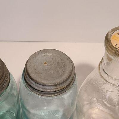 Lot 239: Antique Milk Bottles/Jars ( Gant Dairy Elmer, Moore Bros Mason, White Crown, and Boyd Mason)