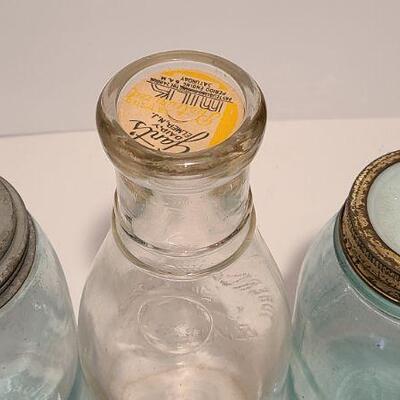 Lot 239: Antique Milk Bottles/Jars ( Gant Dairy Elmer, Moore Bros Mason, White Crown, and Boyd Mason)