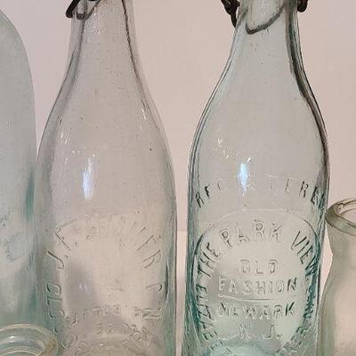 Lot 237: Antique Bottles/Jars ( Large The QUEEN, Zimmer Gloucester, Parkview Newark, Moore Mason)