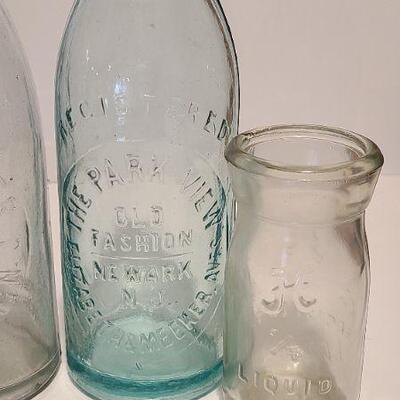 Lot 237: Antique Bottles/Jars ( Large The QUEEN, Zimmer Gloucester, Parkview Newark, Moore Mason)