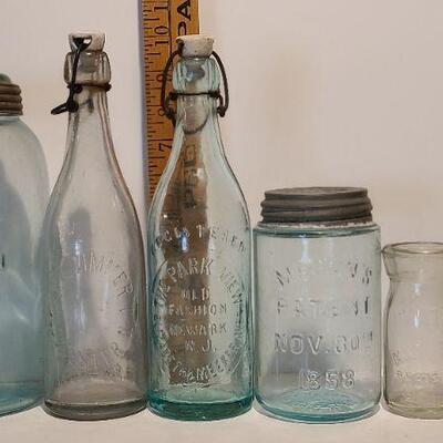 Lot 237: Antique Bottles/Jars ( Large The QUEEN, Zimmer Gloucester, Parkview Newark, Moore Mason)