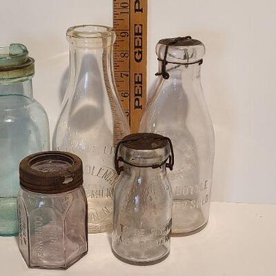 Lot 235: Antique Bottles/Jars ( Borden purple, Coleman Dairy, Whitman VT) 