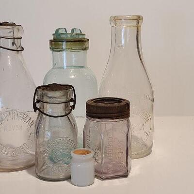 Lot 235: Antique Bottles/Jars ( Borden purple, Coleman Dairy, Whitman VT) 