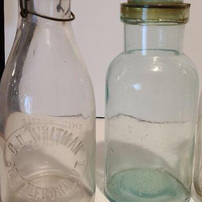 Lot 235: Antique Bottles/Jars ( Borden purple, Coleman Dairy, Whitman VT) 