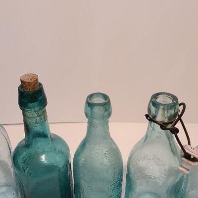 Lot 197: Blue Local Blob Top Soda Bottles ( Mullen, Conner, Eastside, Feiffer)