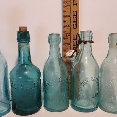 Lot 197: Blue Local Blob Top Soda Bottles ( Mullen, Conner, Eastside, Feiffer)