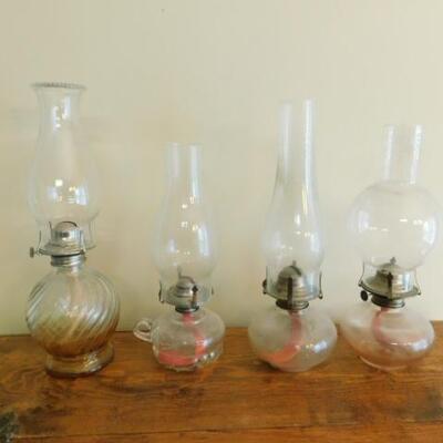 Set of Four Oil Lamps of Various Size and Design