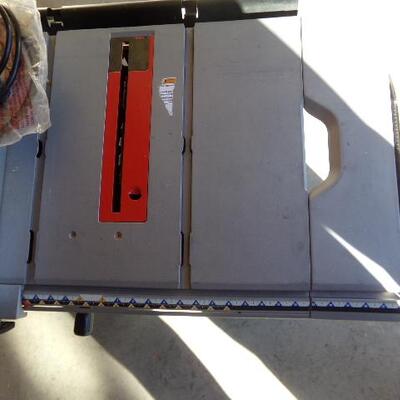 LOT 26  RYOBI 10 INCH TABLE SAW WITH STAND