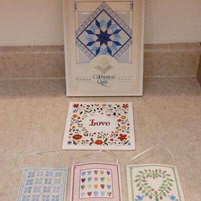 Lot 9: New Celebration Quilts Porcelain Trivet, Vintage Love Trivet & (3) Ceramic Quilt Hanging Deco