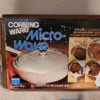 Lot 56: NEW OLD Stock Corning Ware (2) Handles, Microwave Dish and Veggie Strainer 