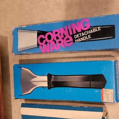 Lot 56: NEW OLD Stock Corning Ware (2) Handles, Microwave Dish and Veggie Strainer 