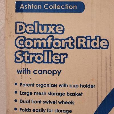 Lot 114: New Deluxe Comfort Ride Stroller by COSCO