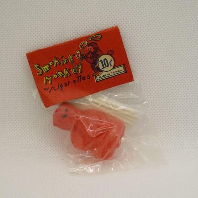 Lot 24 - Red Smoking Monkey with Cigarettes