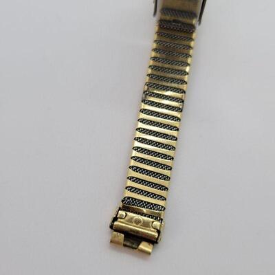 JMO13: Two Vintage copper bracelets and a vintage watch band