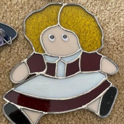 Lot 664 - Stained Glass Doll and hat