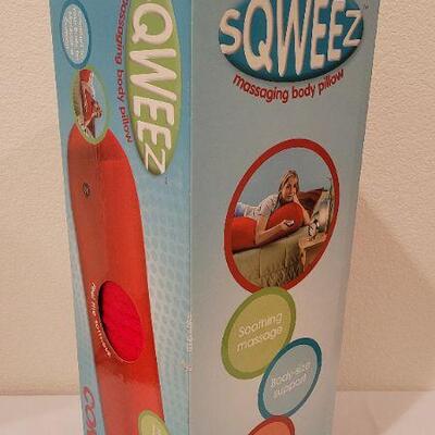 Lot 209: New Large Massaging SQWEEZ Red Body Pillow 