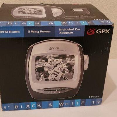 Lot 225: New GPX Black and White Television w/ Car Adapter 