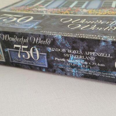 Lot 258: (2) New 750 pc. Whimsical Puzzles