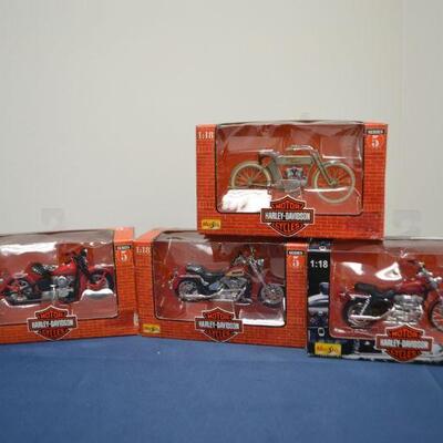LOT 558    FOUR HARLEY DAVIDSON MOT0RCYCLE COLLECTIBLES 